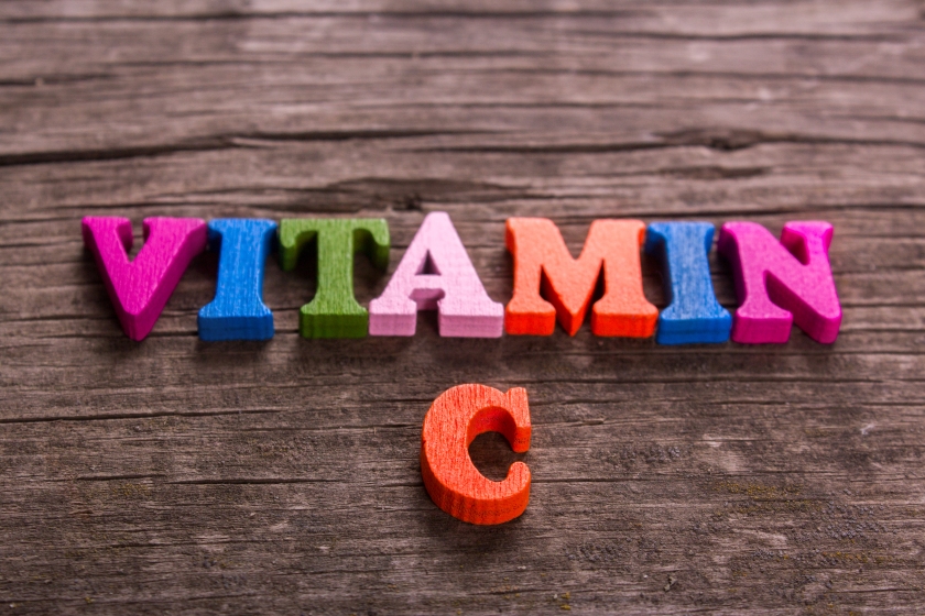 Vitamin C in spelled with wooden letters.